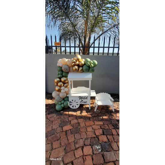 Garland on Small Candy Cart with small chair. ( candy cart meaures 1.5heightx80cm)